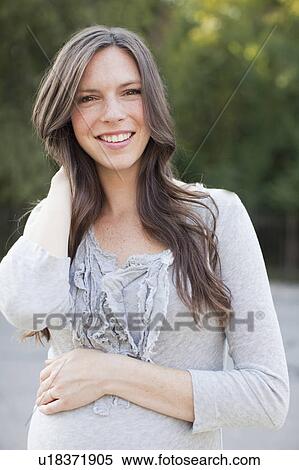 Portrait of pregnant mid adult woman View Large Photo Image Stock Photography - Portrait of pregnant mid adult woman. Fotosearch