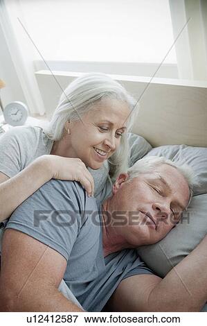 Portrait of senior couple laying in bed in morning View Large Photo Image Stock Photo - Portrait of senior couple laying in bed in morning. Fotosearch