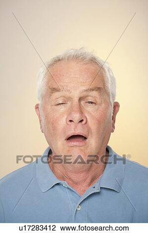 Portrait of senior man pulling funny face View Large Photo Image Stock Image - Portrait of senior man pulling funny face. Fotosearch