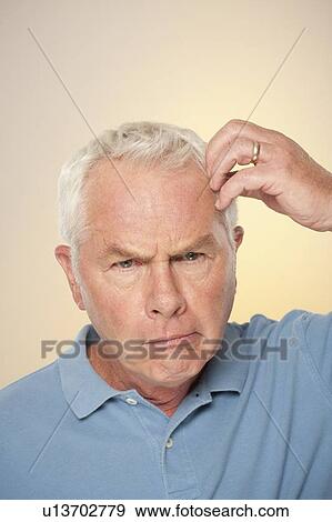 Portrait of senior man pulling funny face View Large Photo Image Stock Photo - Portrait of senior man pulling funny face. Fotosearch