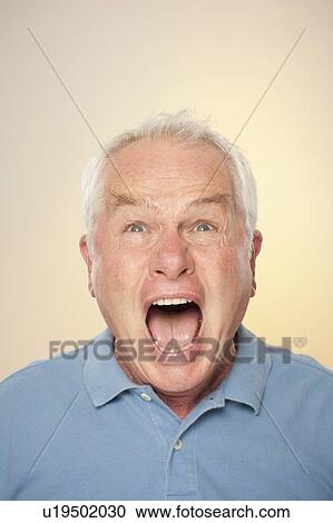 Stock Image - Portrait of senior man screaming. Fotosearch