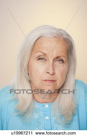 Portrait of senior woman with suspicious face expression View Large Photo Image Stock Image - Portrait of senior woman with suspicious face expression. Fotosearch