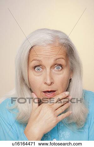 Portrait of senior woman with surprise face expression View Large Photo Image Stock Image - Portrait of senior woman with surprise face expression. Fotosearch