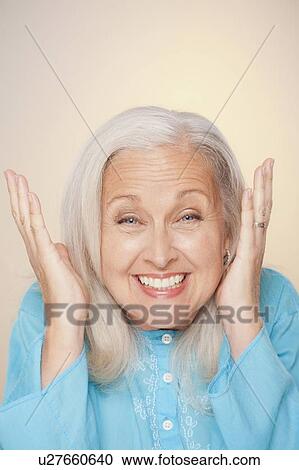 Stock Image - Portrait of senior woman with surprise face expression. Fotosearch