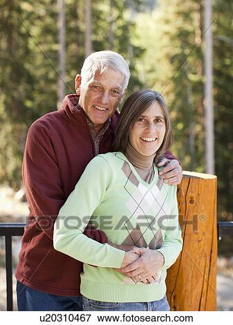 Portrait of smiling couple outdoors View Large Photo Image Stock Photo - Portrait of smiling couple outdoors. Fotosearch