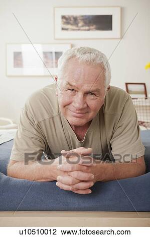 Stock Image - Portrait of smiling senior man . Fotosearch