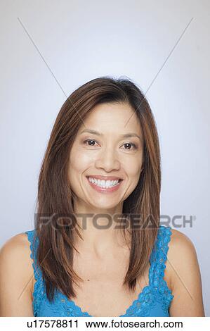 Stock Image - Portrait of smiling woman. Fotosearch