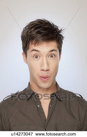 Stock Photo - Portrait of surprised man. Fotosearch