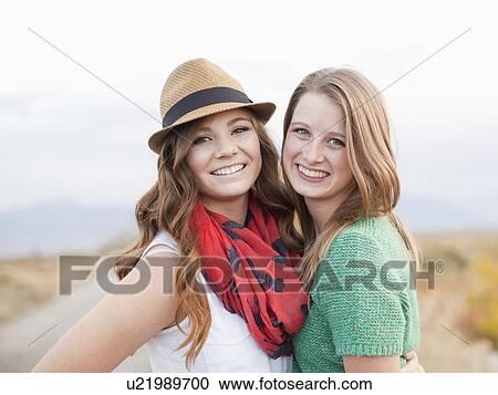 Portrait of two young women cheek to cheek View Large Photo Image Stock Image - Portrait of two young women cheek to cheek. Fotosearch