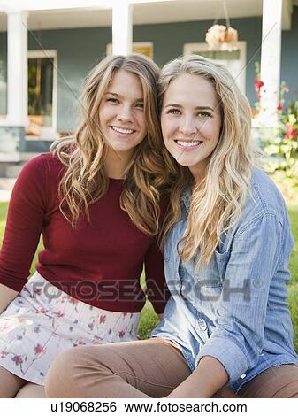 Portrait of two young women cheek to cheek View Large Photo Image Stock Photograph - Portrait of two young women cheek to cheek. Fotosearch