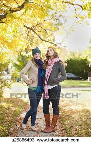 Portrait of two young women in autumn day View Large Photo Image Stock Image - Portrait of two young women in autumn day. Fotosearch