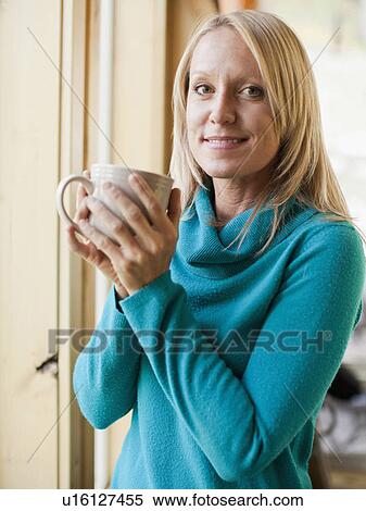 Portrait of woman drinking coffee View Large Photo Image Stock Photography - Portrait of woman drinking coffee. Fotosearch