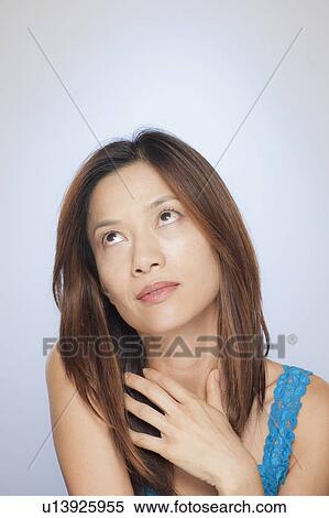 Portrait of woman looking up View Large Photo Image Stock Photography - Portrait of woman looking up. Fotosearch