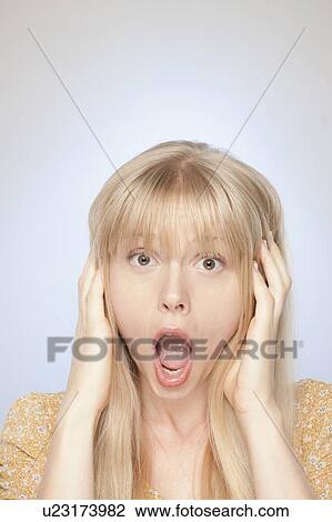 Stock Image - Portrait of woman yelling. Fotosearch