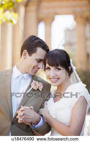 Stock Image - Portrait of young bride and groom. Fotosearch