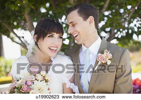Stock Image - Portrait of young bride and groom. Fotosearch