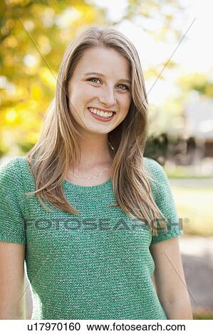 Portrait of young woman smiling View Large Photo Image Stock Image - Portrait of young woman smiling. Fotosearch