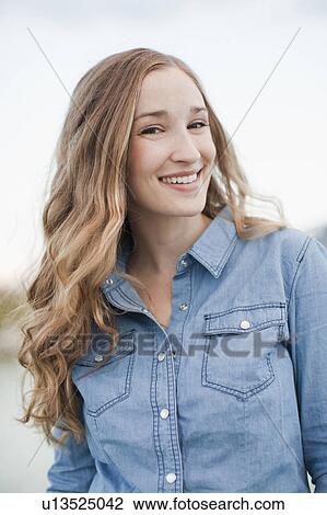 Stock Image - Portrait of young woman. Fotosearch