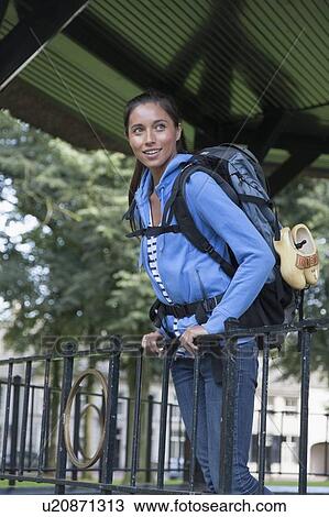 Portrait of young woman with backpack View Large Photo Image Stock Image - Portrait of young woman with backpack. Fotosearch