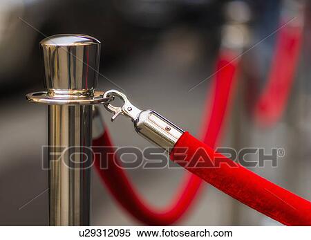 Stock Photography - Red rope and stanchion. Fotosearch