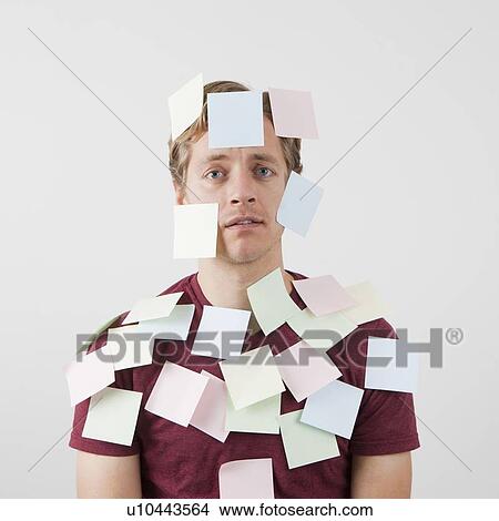 Sad man being covered with adhesive notes View Large Photo Image Picture - Sad man being covered with adhesive notes. Fotosearch