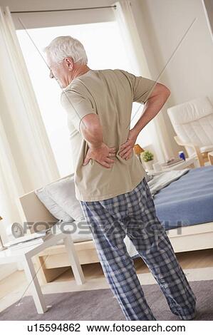 Senior man having backpain View Large Photo Image Stock Image - Senior man having backpain. Fotosearch