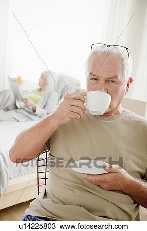 Senior man having morning cup of coffee View Large Photo Image Stock Image - Senior man having morning cup of coffee. Fotosearch