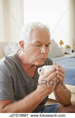 Senior man holding mug View Large Photo Image Stock Photo - Senior man holding mug. Fotosearch