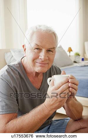 Senior man holding mug View Large Photo Image Stock Photograph - Senior man holding mug. Fotosearch