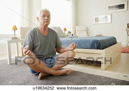 Senior man meditating View Large Photo Image Stock Image - Senior man meditating. Fotosearch