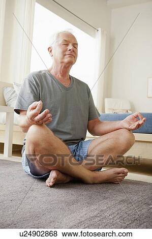 Senior man meditating View Large Photo Image Stock Photo - Senior man meditating. Fotosearch