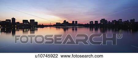 Silhouette of city at dusk View Large Photo Image Stock Image - Silhouette of city at dusk. Fotosearch