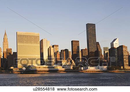 Skyline with Chrysler Building at sunset View Large Photo Image Stock Photo - Skyline with Chrysler Building at sunset. Fotosearch
