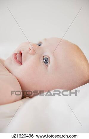 Stock Photograph - Smiling baby boy (2-5 months). Fotosearch