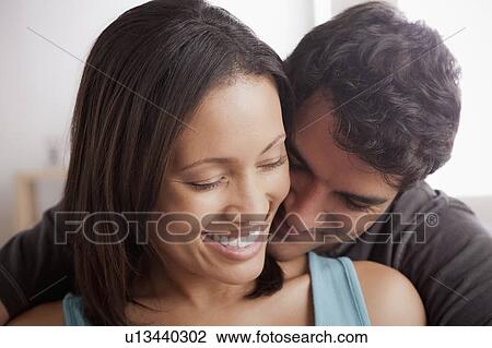 Smiling couple in close embrace View Large Photo Image Stock Image - Smiling couple in close embrace. Fotosearch