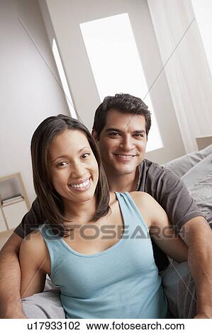 Smiling couple in close embrace View Large Photo Image Stock Image - Smiling couple in close embrace. Fotosearch