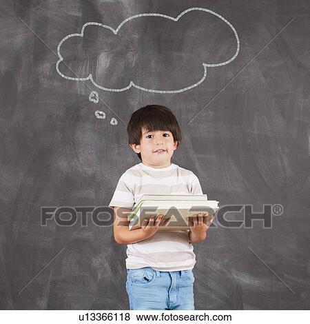 Studio portrait of boy (6-7) with thought bubble View Large Photo Image Stock Photo - Studio portrait of boy (6-7) with thought bubble. Fotosearch