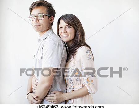 Studio portrait of couple View Large Photo Image Stock Image - Studio portrait of couple. Fotosearch