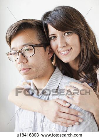 Studio portrait of couple View Large Photo Image Stock Image - Studio portrait of couple. Fotosearch