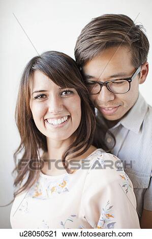 Studio portrait of couple View Large Photo Image Stock Image - Studio portrait of couple. Fotosearch