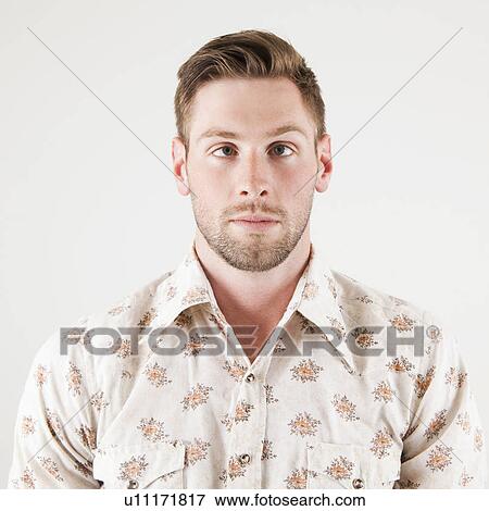 Stock Photo - Studio portrait of cross-eyed man. Fotosearch