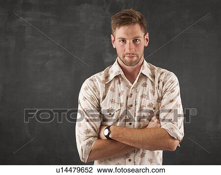 Stock Image - Studio portrait of young man. Fotosearch