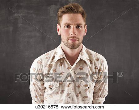 Studio portrait of young man View Large Photo Image Stock Photography - Studio portrait of young man. Fotosearch