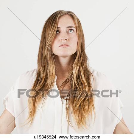 Picture - Studio portrait of young woman. Fotosearch