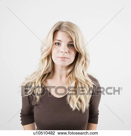 Stock Image - Studio portrait of young woman. Fotosearch