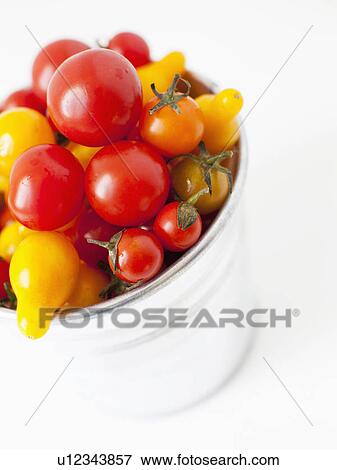 Stock Photo - Studio Shot of Cherry Tomatoes in plastic container. Fotosearch