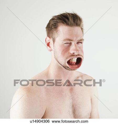 Stock Photograph - Studio shot of man with windblown mouth. Fotosearch