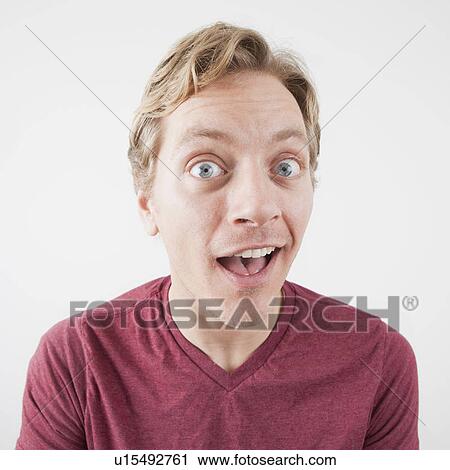 Studio Shot of mid adult man expressing surprise with eyes wide open View Large Photo Image Stock Image - Studio Shot of mid adult man expressing surprise with eyes wide open. Fotosearch