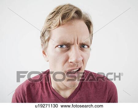 Studio Shot of mid adult man expressing anger View Large Photo Image Stock Image - Studio Shot of mid adult man expressing anger. Fotosearch