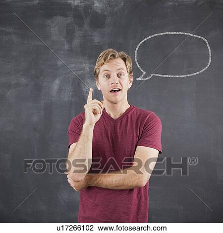 Studio shot of mid adult man with chalk drawing of speech bubble on blackboard View Large Photo Image Stock Image - Studio shot of mid adult man with chalk drawing of speech bubble on blackboard. Fotosearch